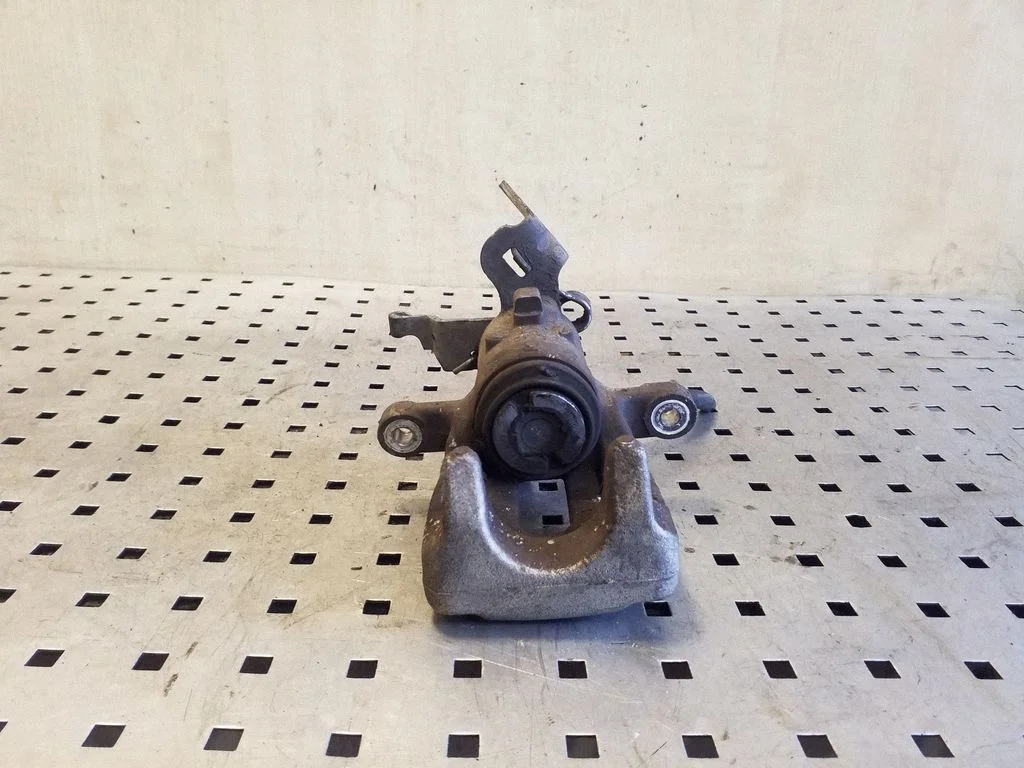 Rear brake caliper – left