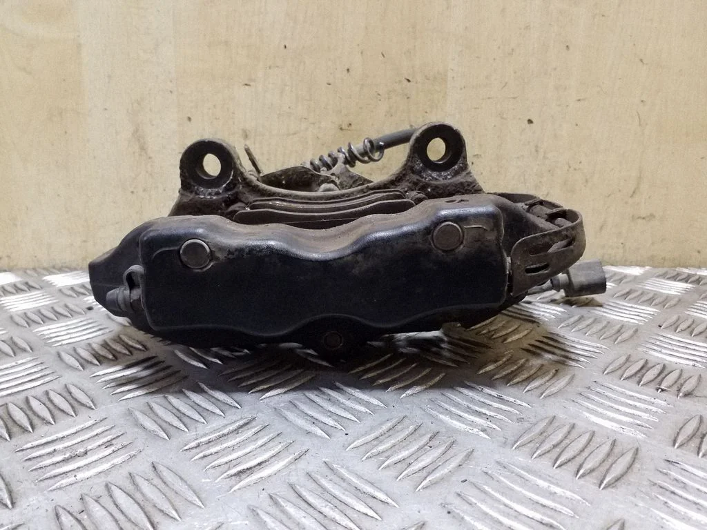 Rear brake caliper – left