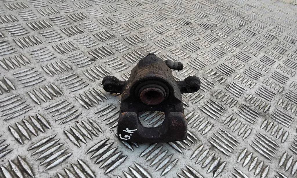 Rear brake caliper – left