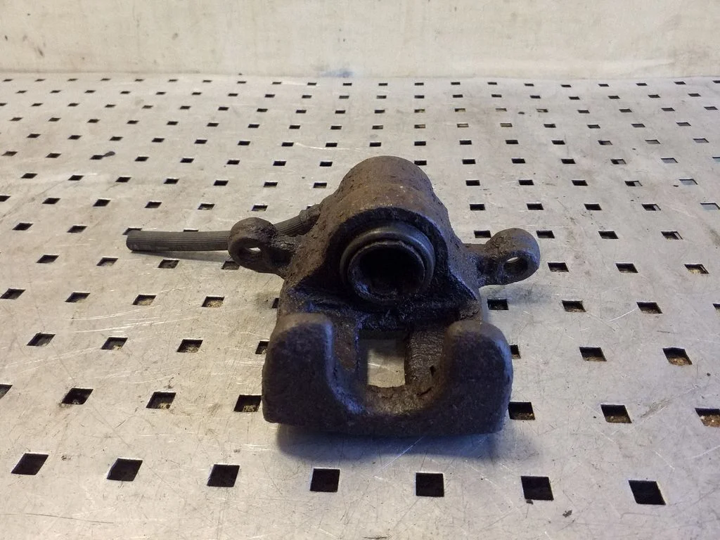 Rear brake caliper – right