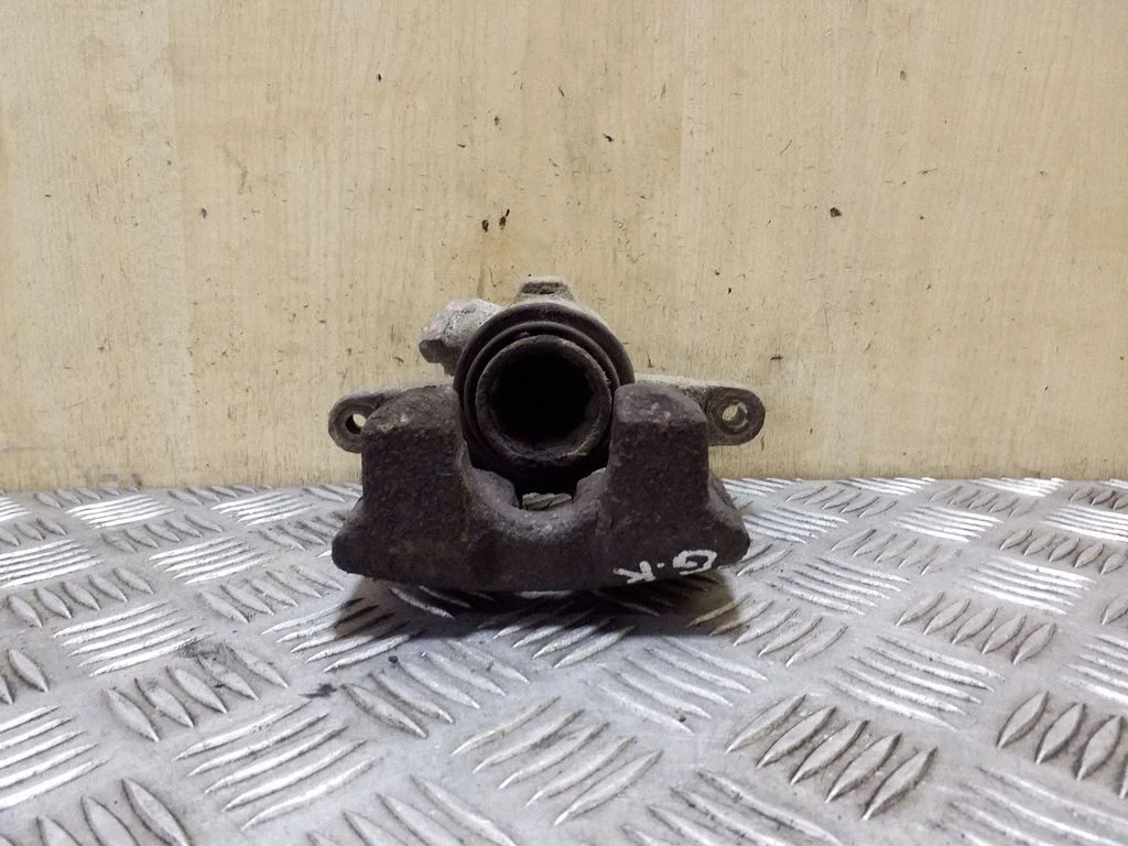 Rear brake caliper – left
