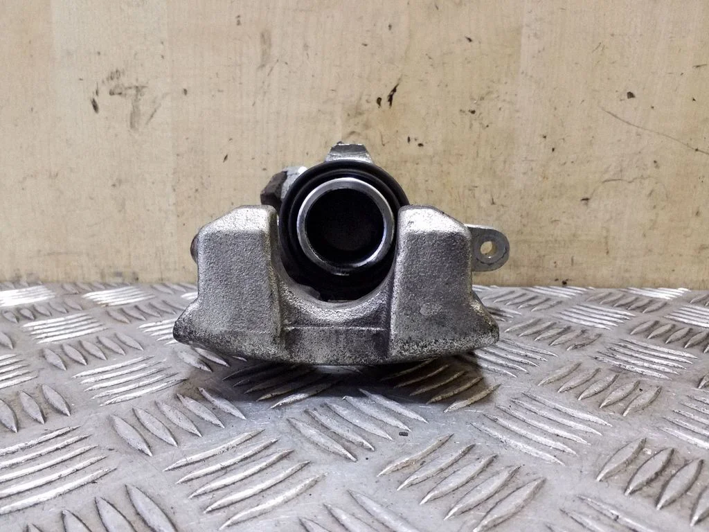 Rear brake caliper – left