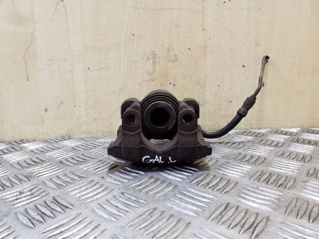 Rear brake caliper – left