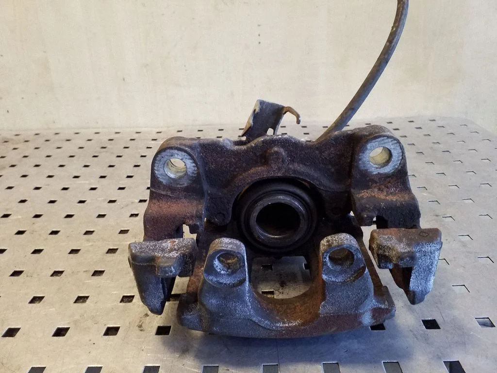 Rear brake caliper – left