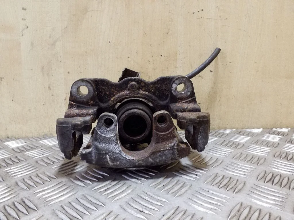 Rear brake caliper – left