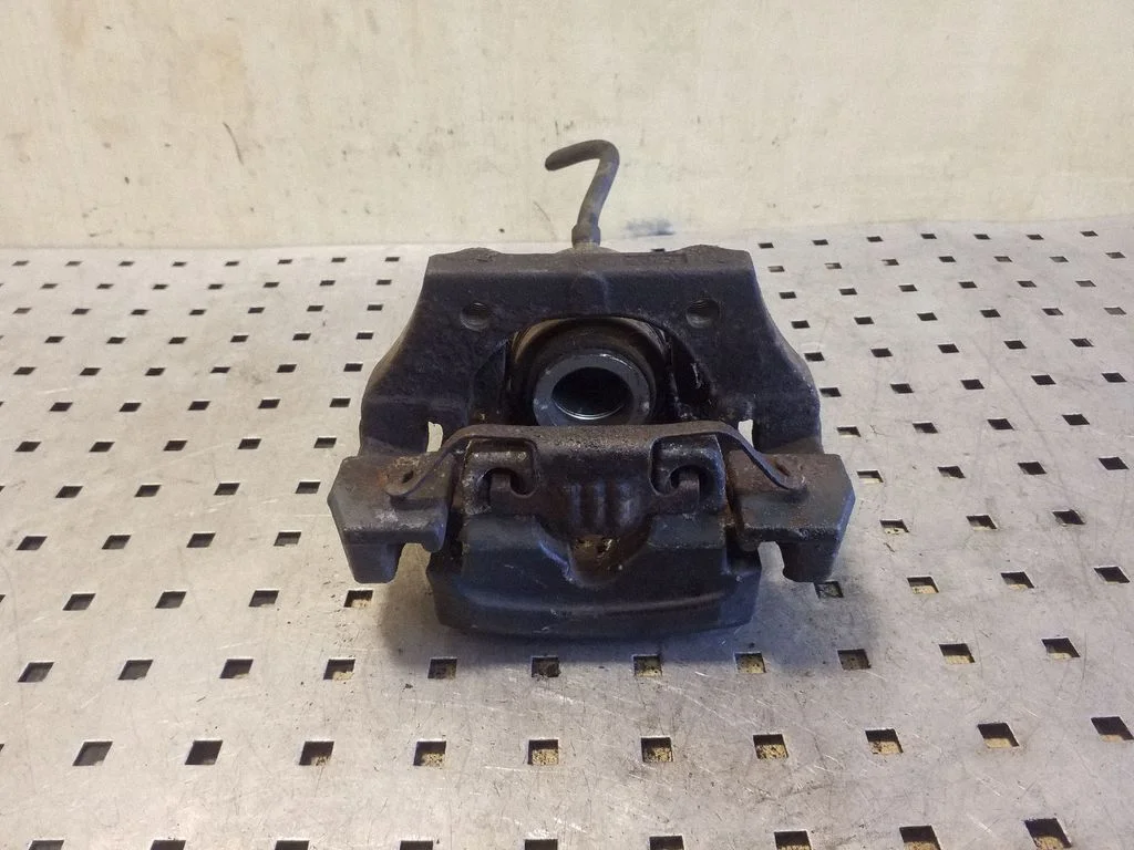 Rear brake caliper – left