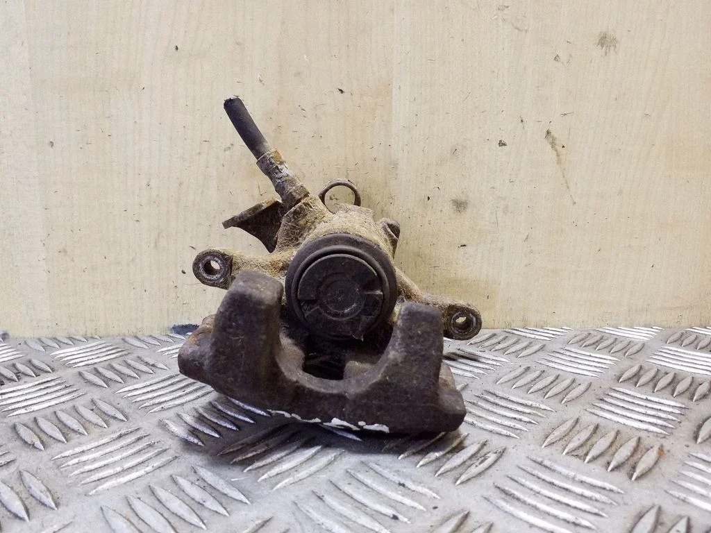 Rear brake caliper – left
