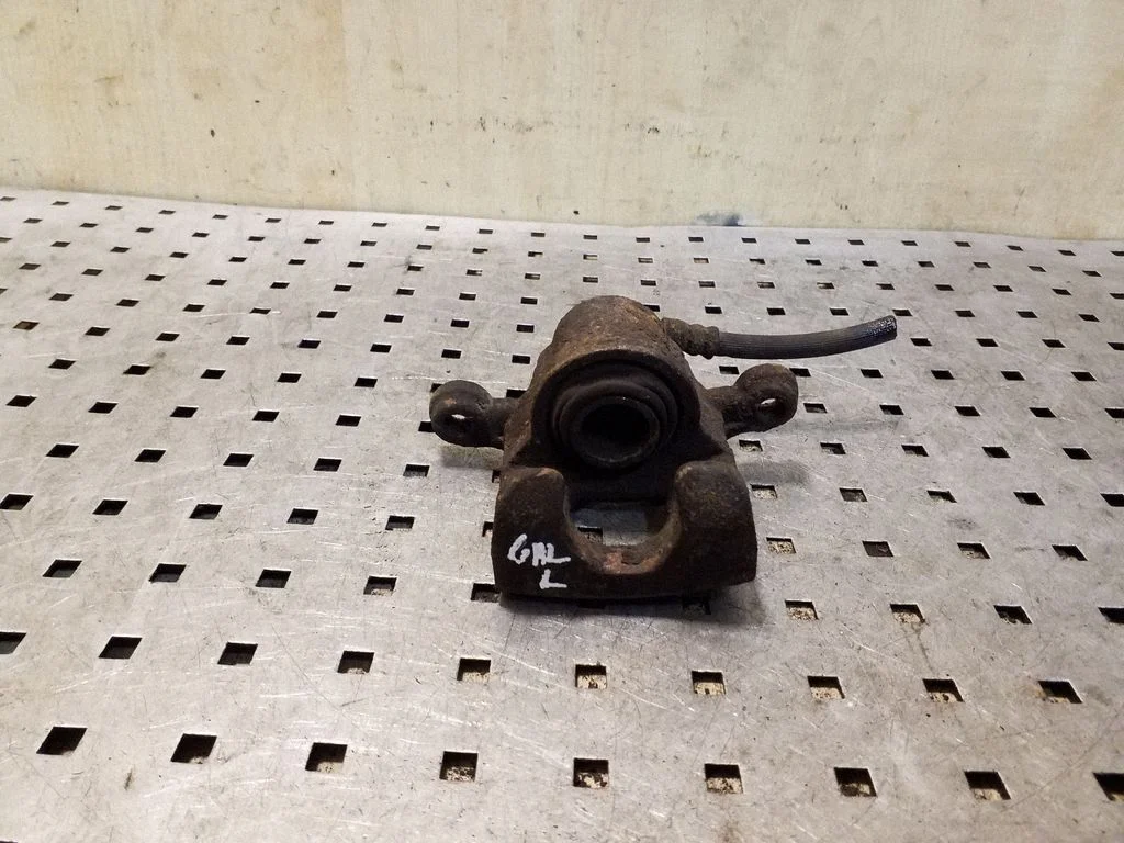 Rear brake caliper – left