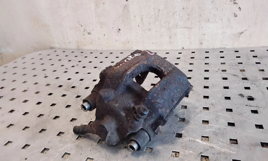 Rear brake caliper – left