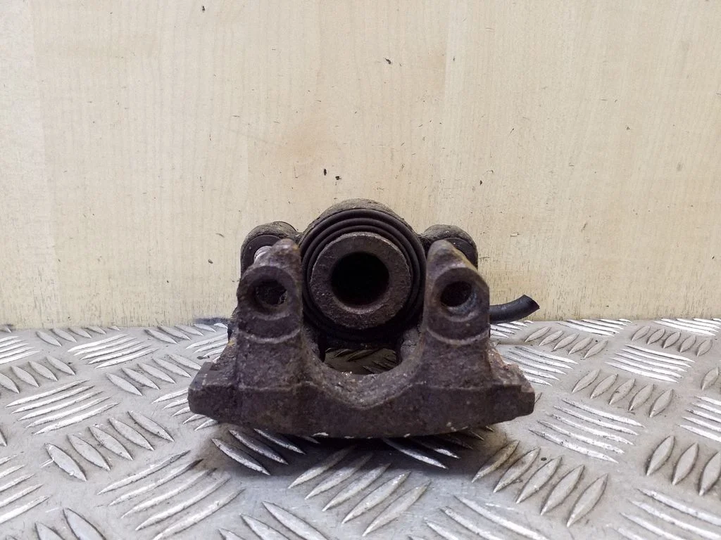 Rear brake caliper – left