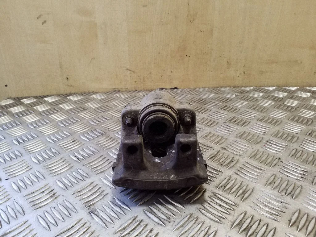 Rear brake caliper – left