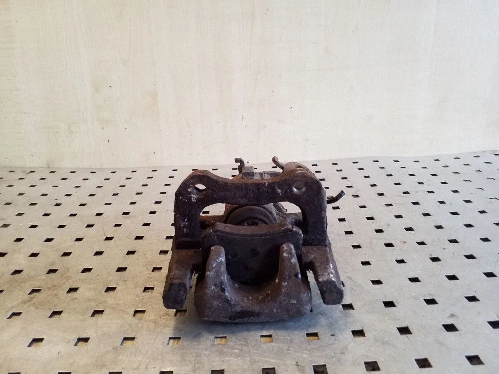 Rear brake caliper – left
