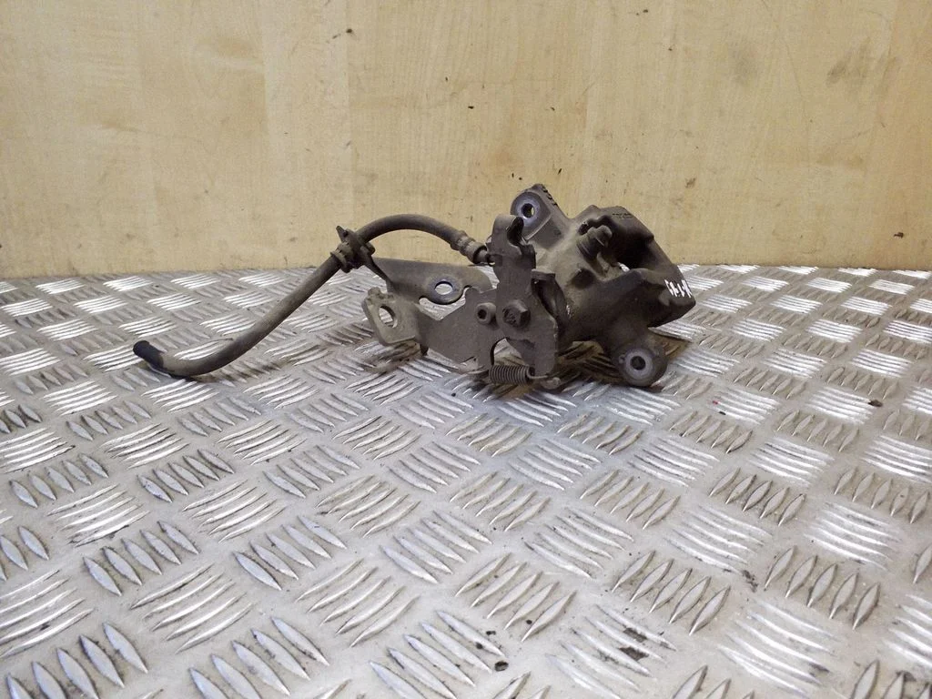 Rear brake caliper – right