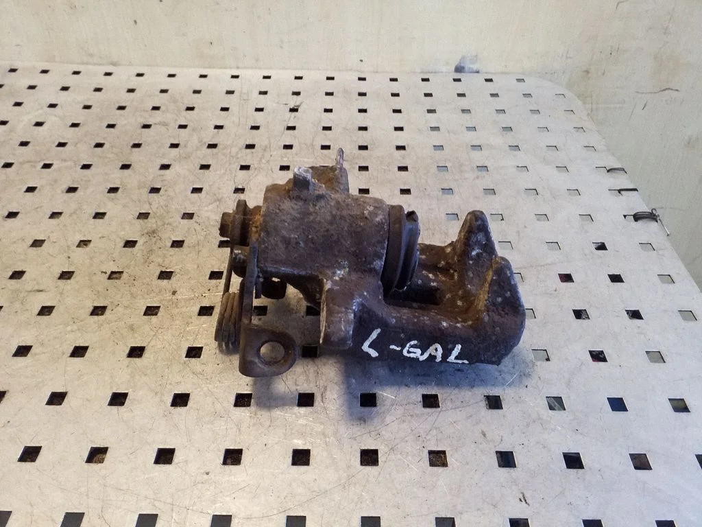 Rear brake caliper – left