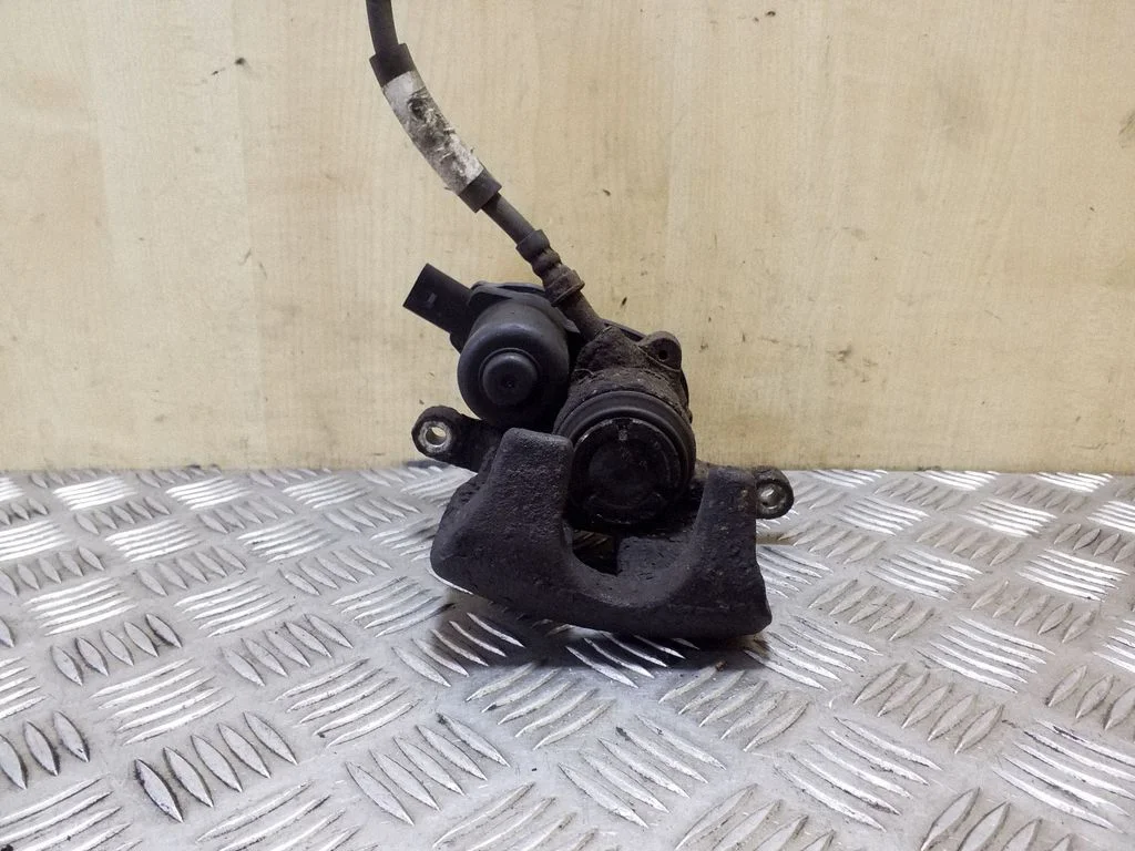 Rear brake caliper – left