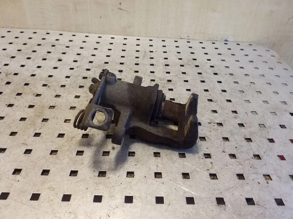 Rear brake caliper – right