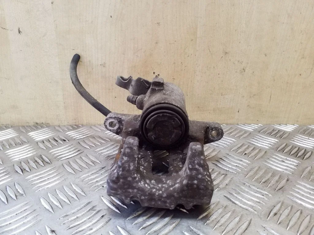 Rear brake caliper – left