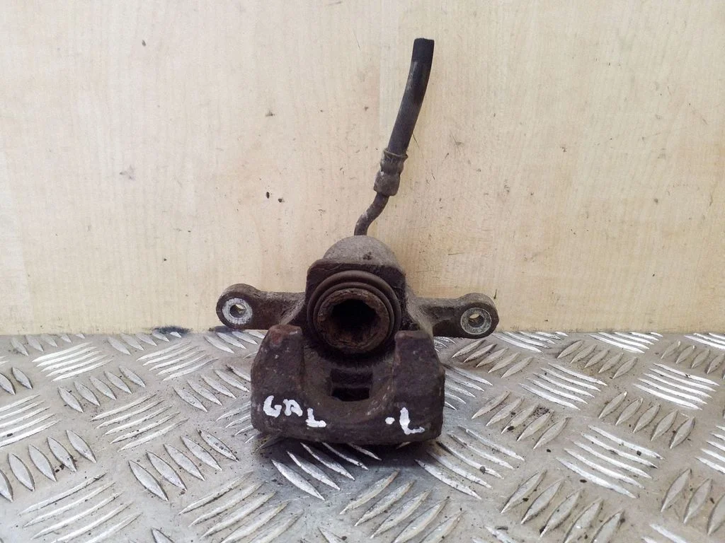 Rear brake caliper – left