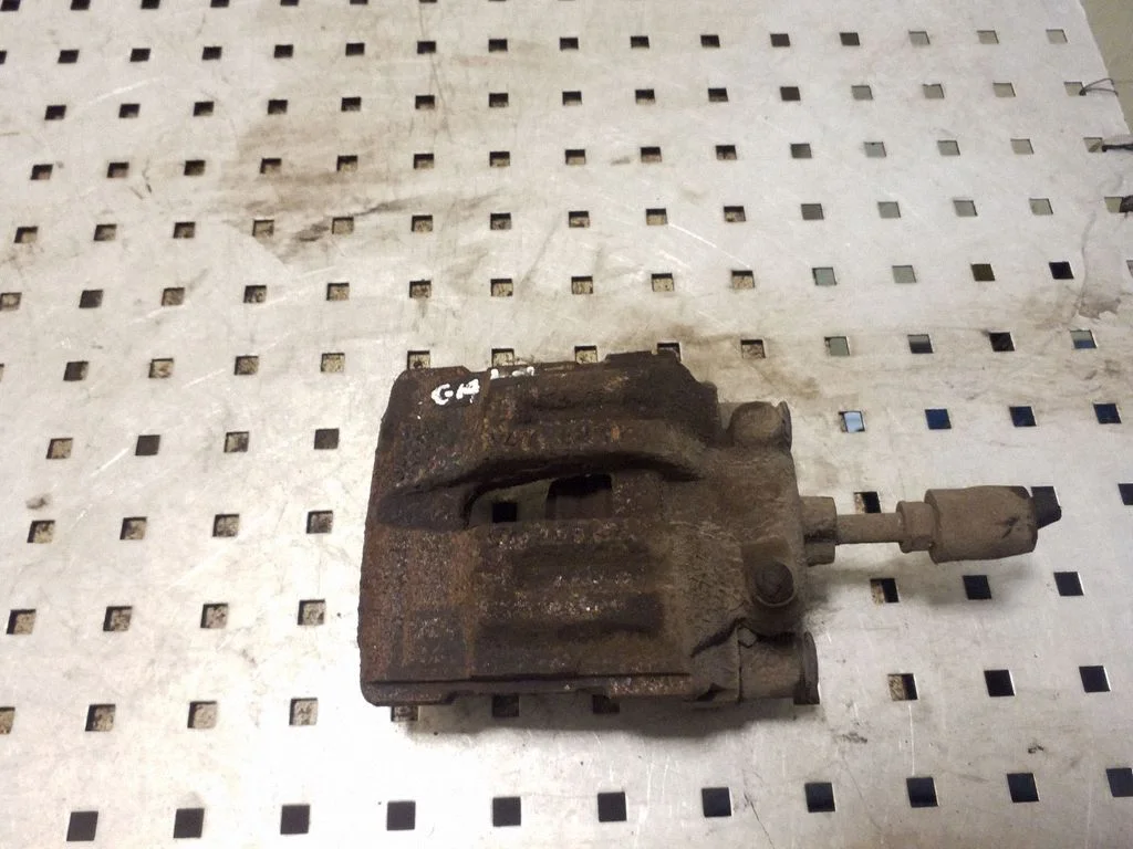 Rear brake caliper – left