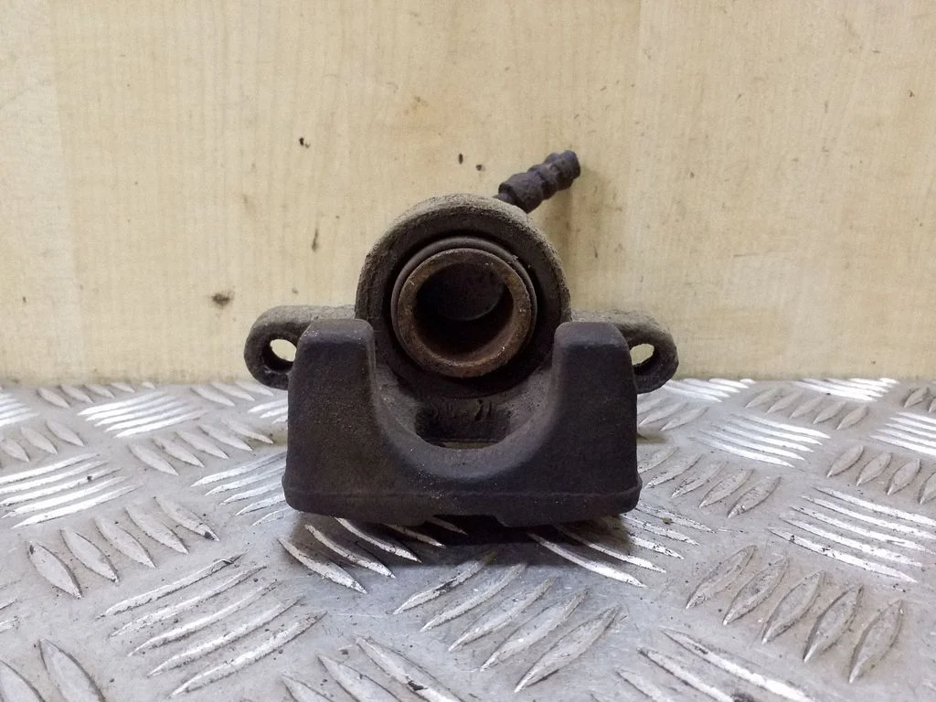 Rear brake caliper – left