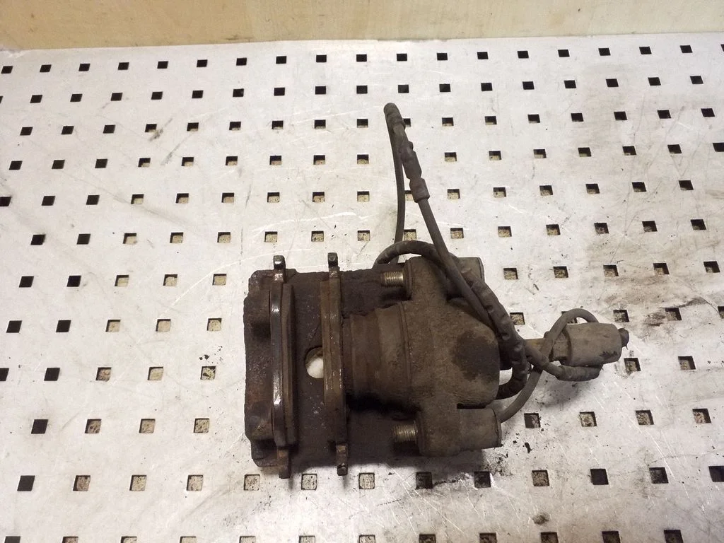 Rear brake caliper – right
