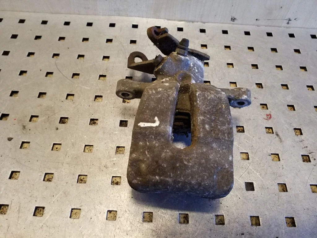 Rear brake caliper – left