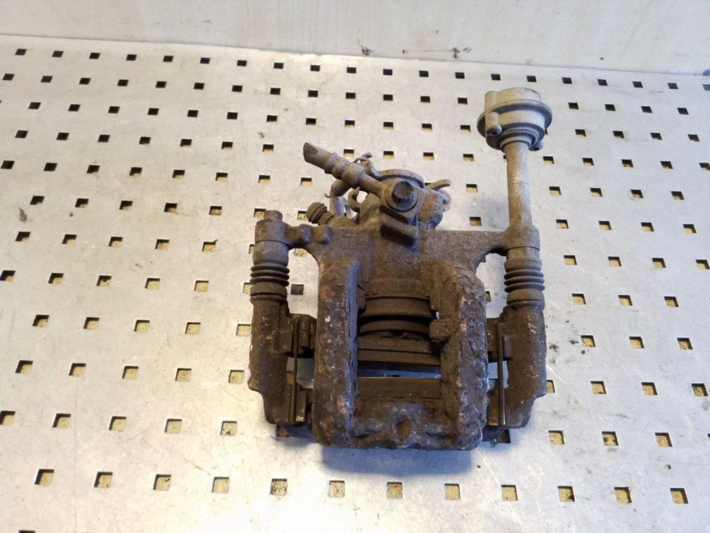 Rear brake caliper – left
