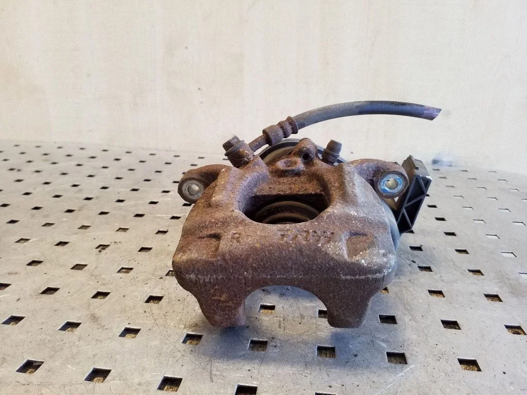 Rear brake caliper – right