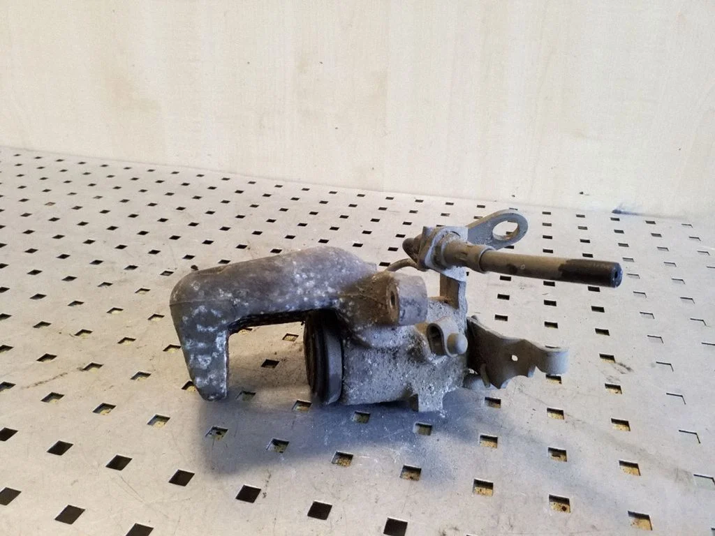 Rear brake caliper – left