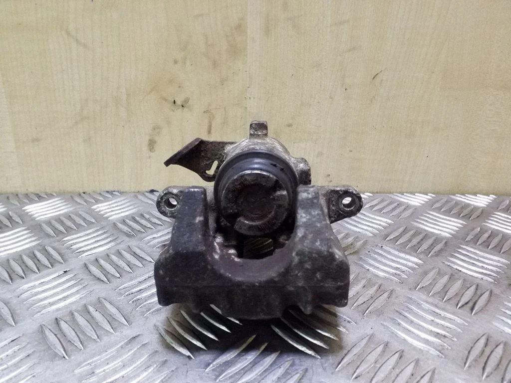 Rear brake caliper – left
