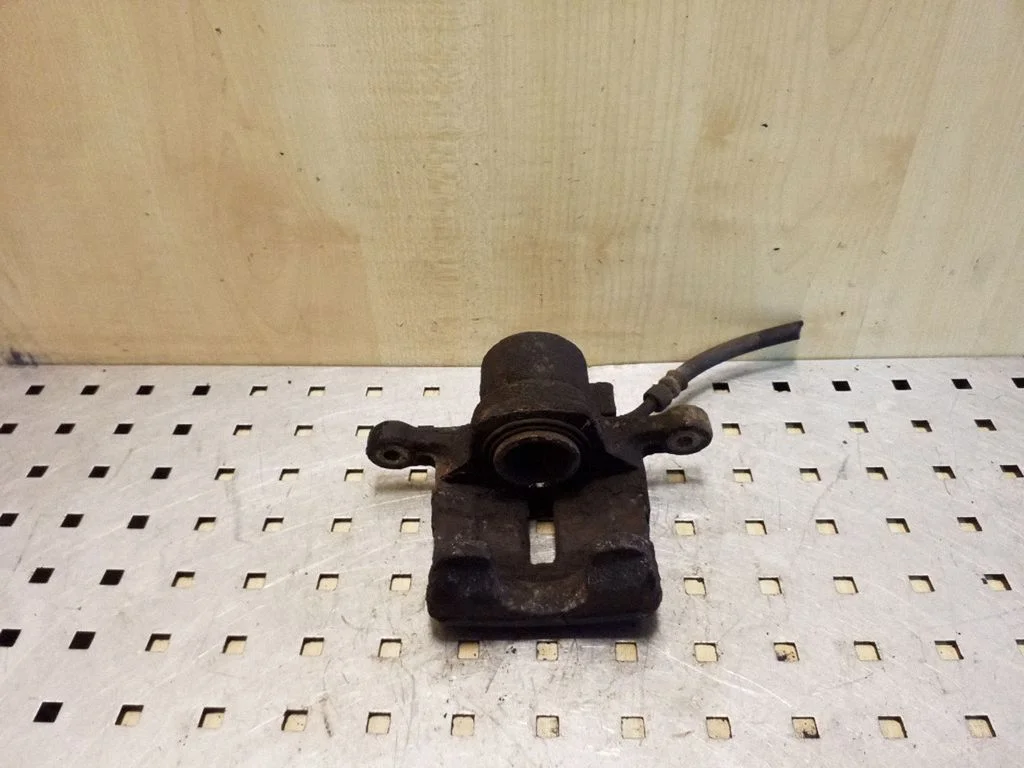 Rear brake caliper – left