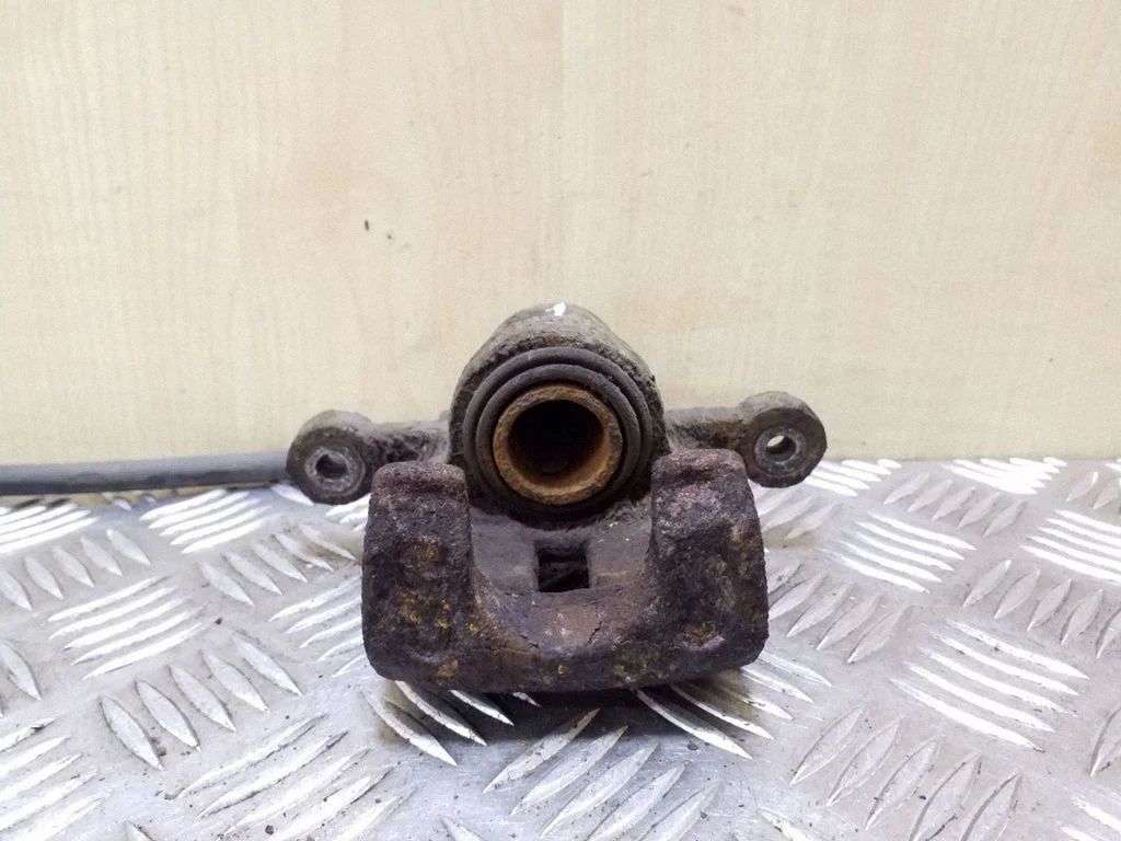 Rear brake caliper – left