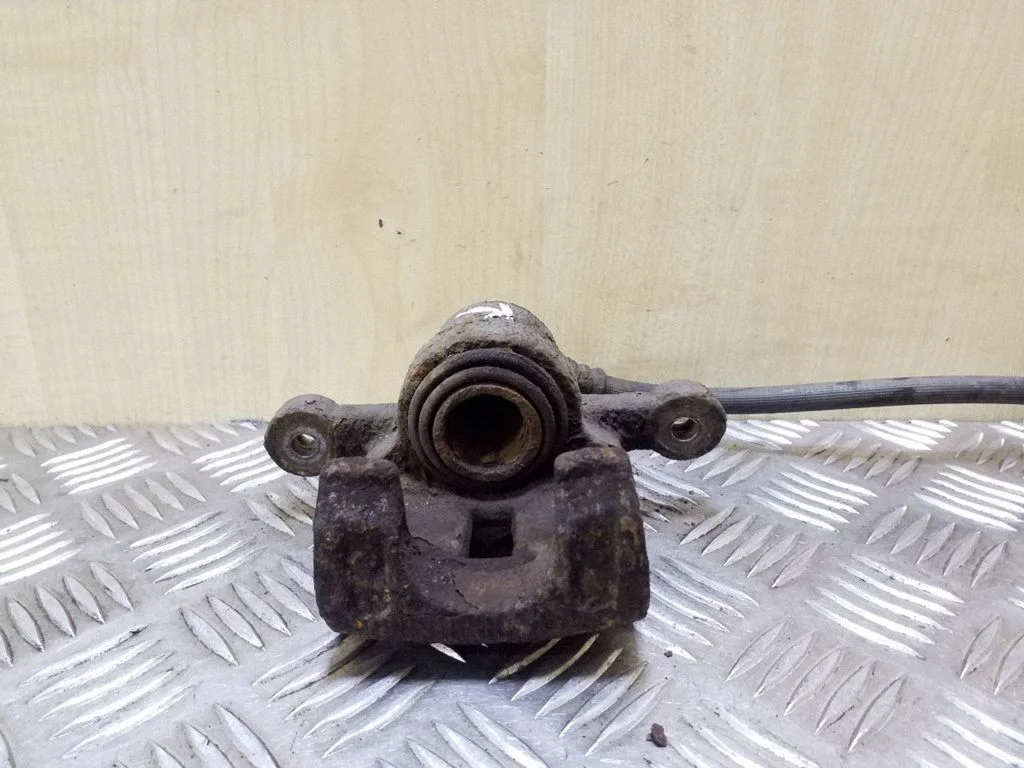 Rear brake caliper – right