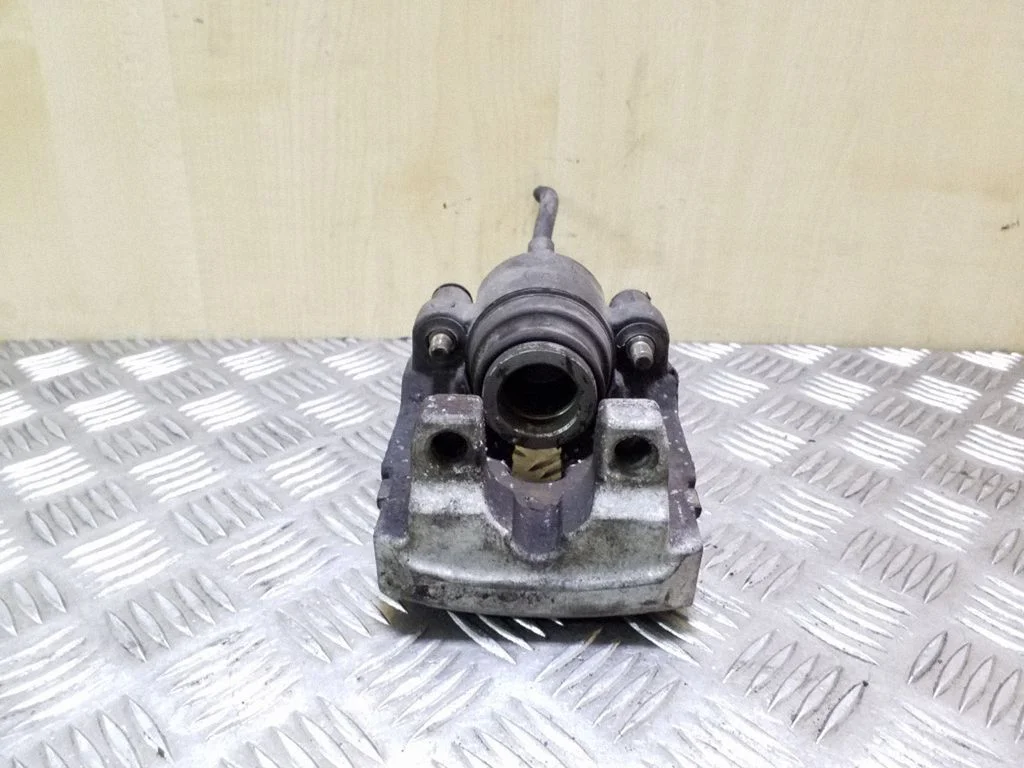 Rear brake caliper – left