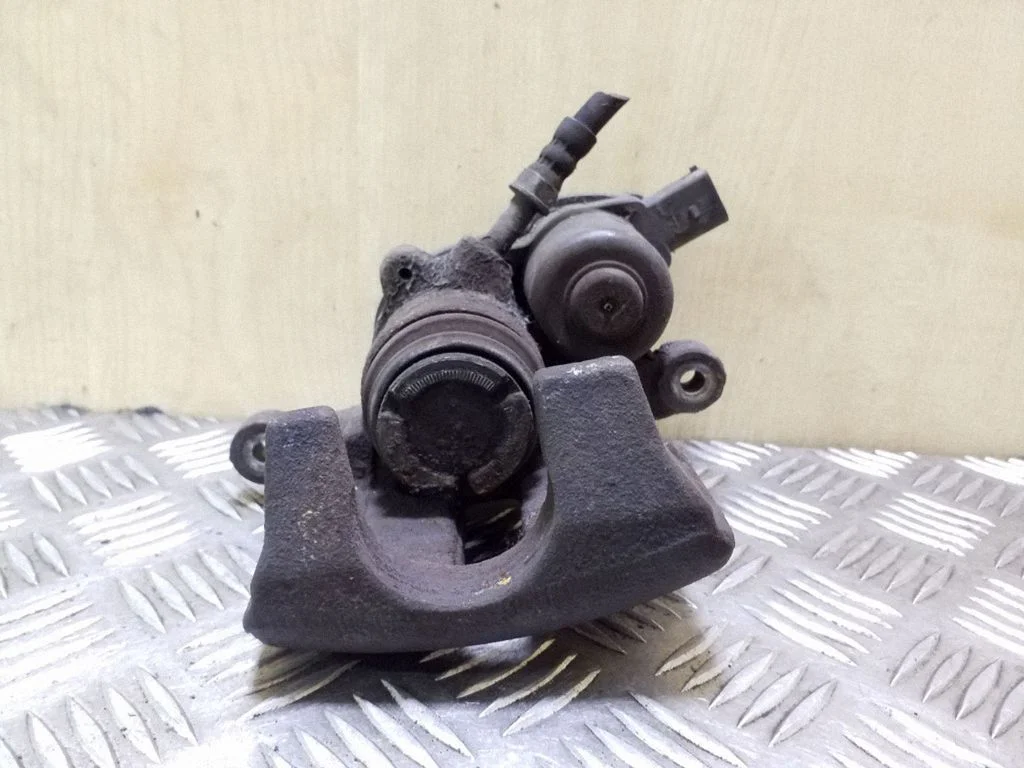Rear brake caliper – right