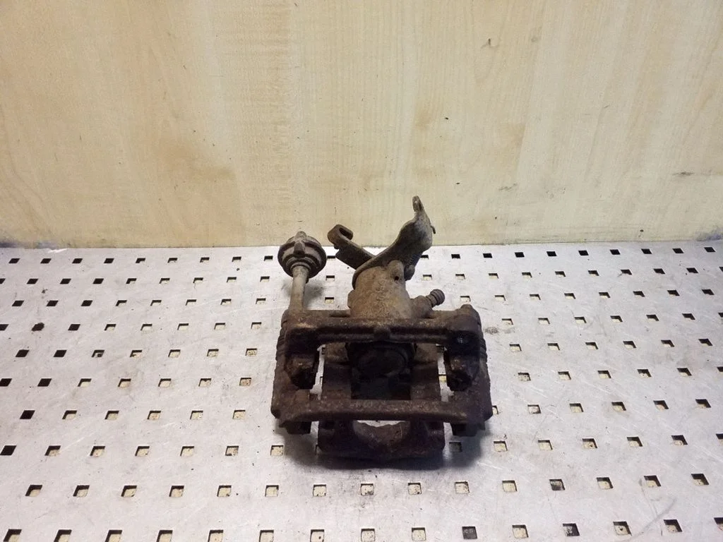 Rear brake caliper – left