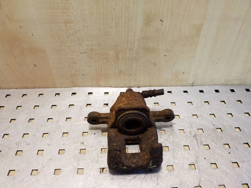 Rear brake caliper – left