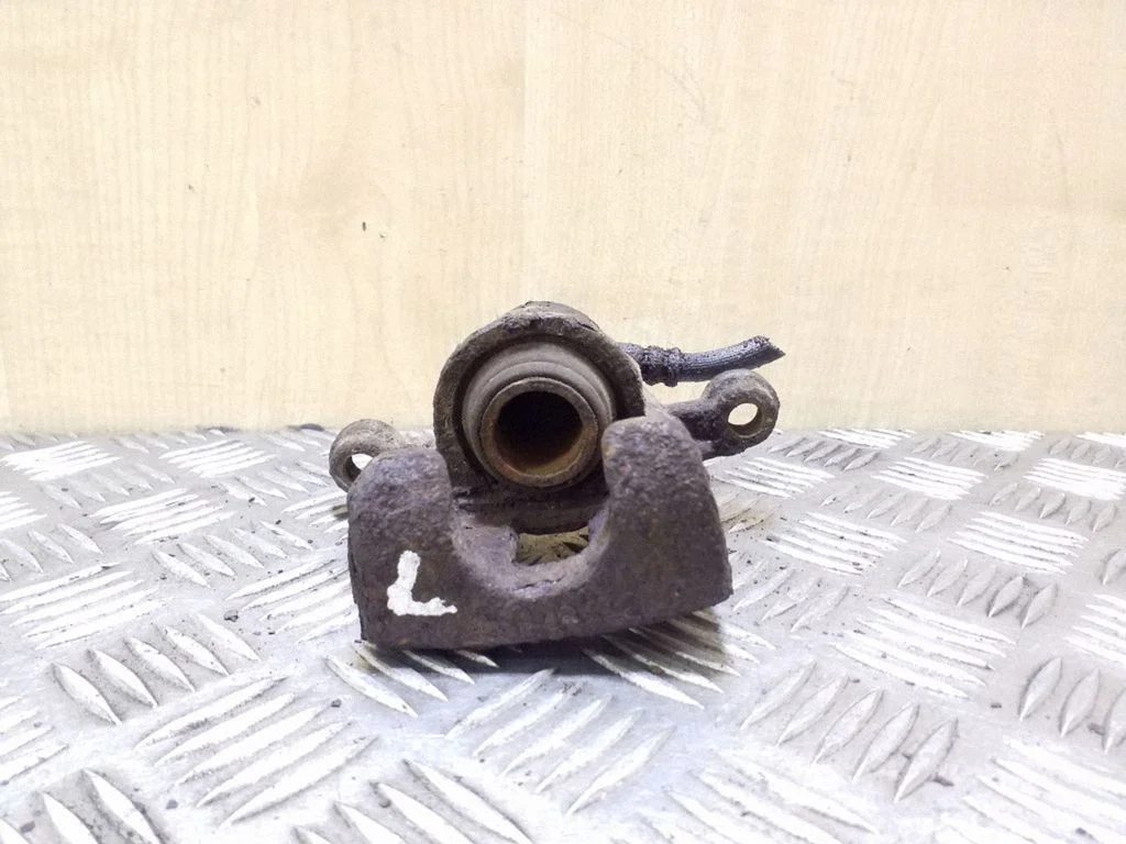 Rear brake caliper – left