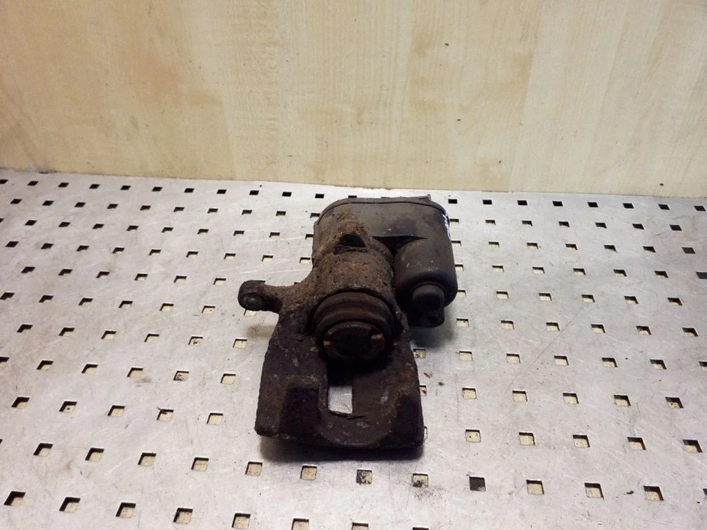 Rear brake caliper – left
