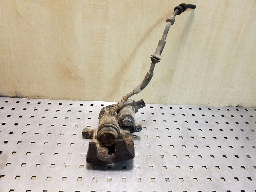 Rear brake caliper – right
