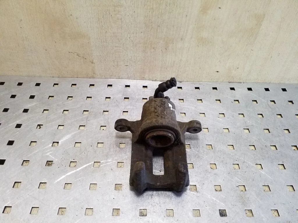 Rear brake caliper – left