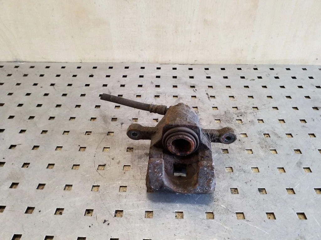 Rear brake caliper – left