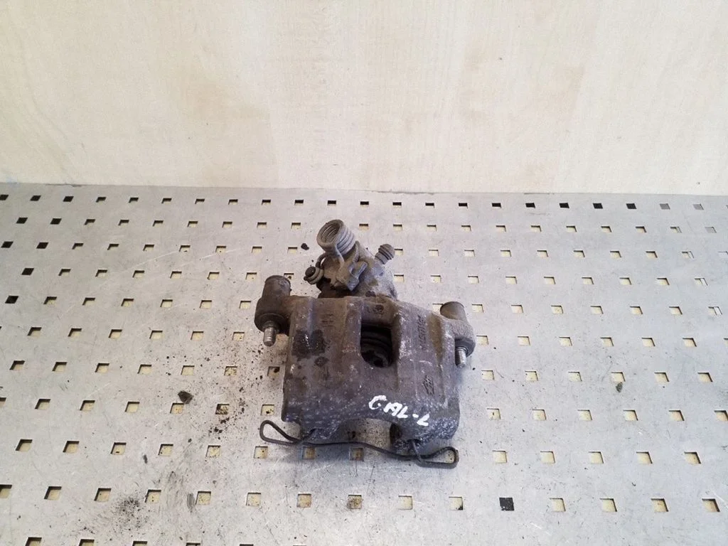 Rear brake caliper – left