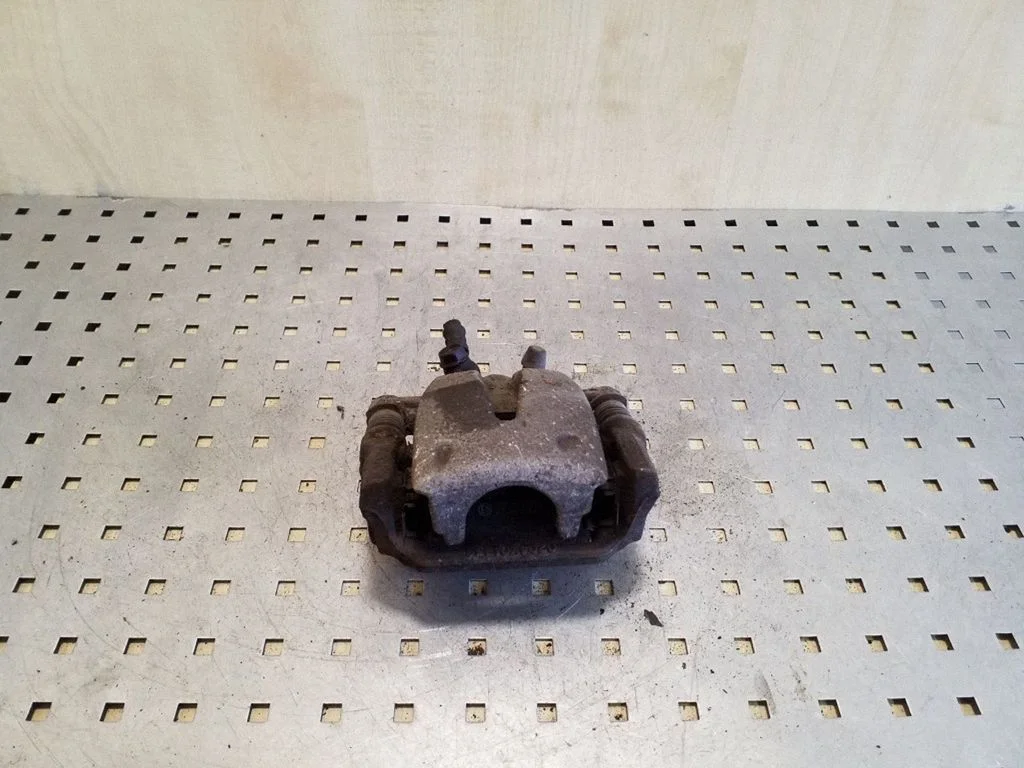 Rear brake caliper – left