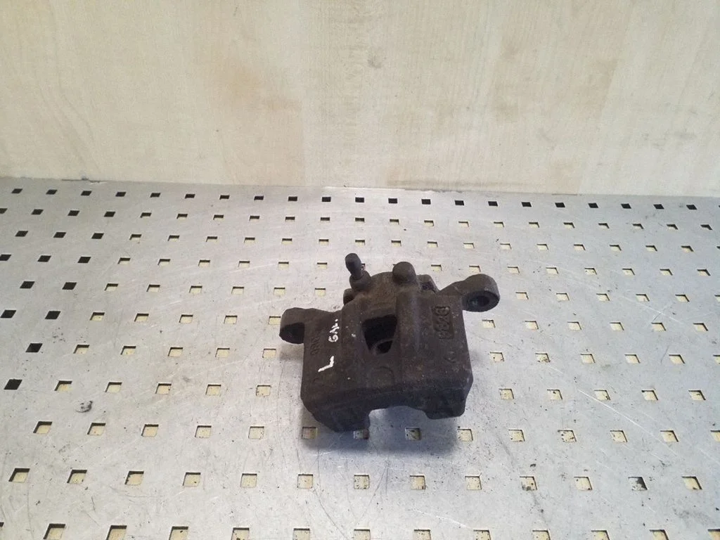 Rear brake caliper – left