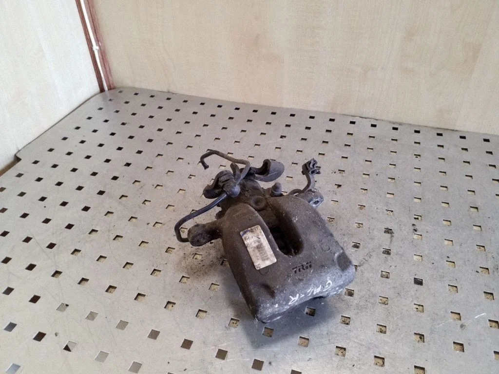 Rear brake caliper – right