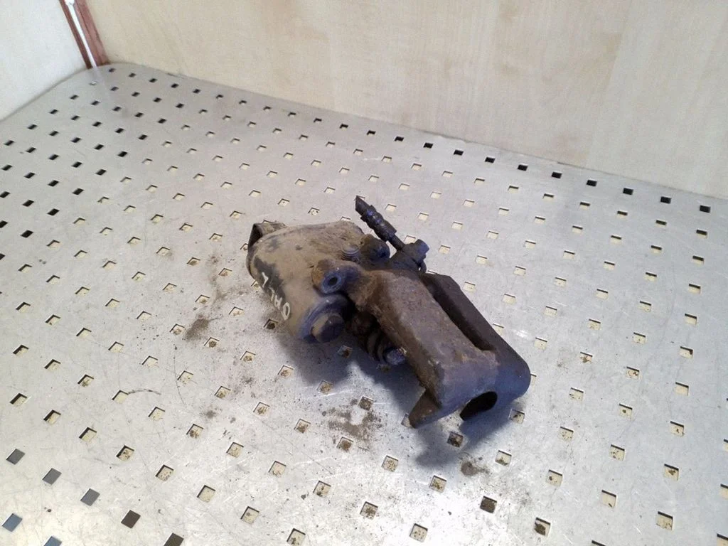 Rear brake caliper – left