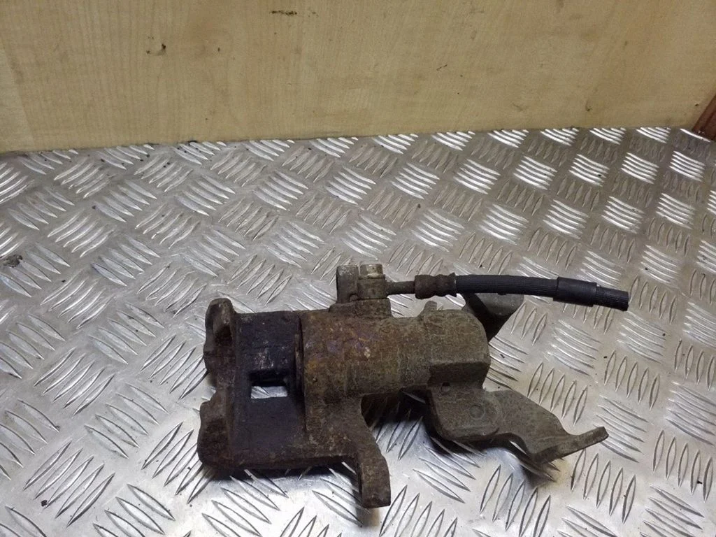 Rear brake caliper – left