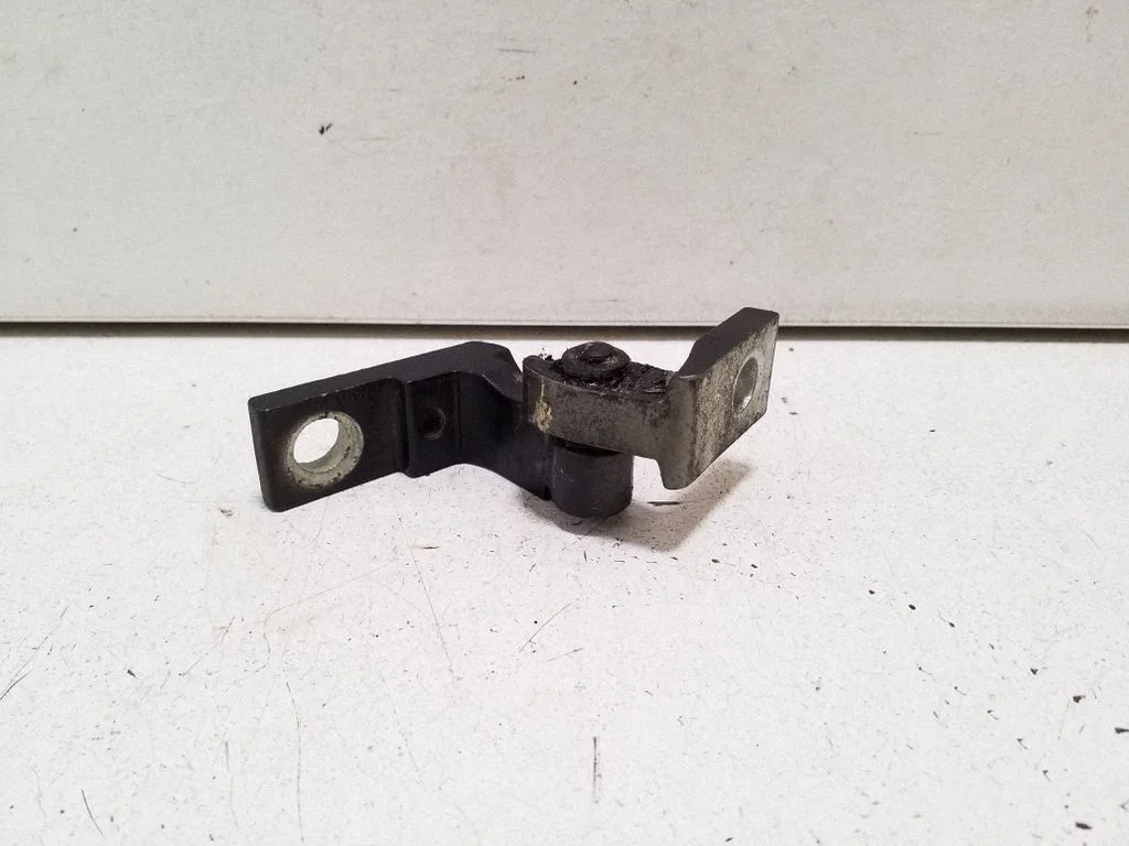 Front door upper hinge – left