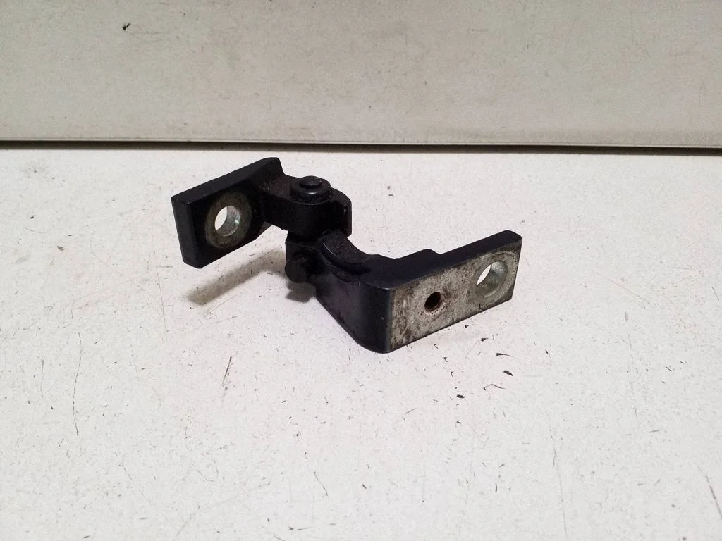 Front door upper hinge – left